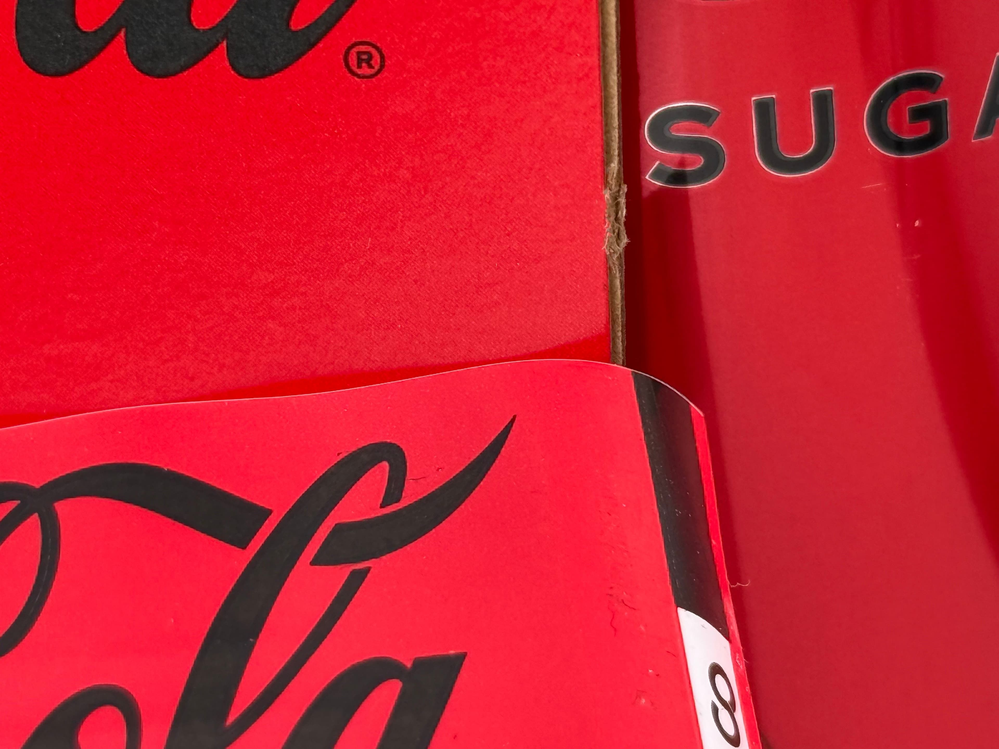 Metal, plastic and paperboard next to eachother showing contrasts